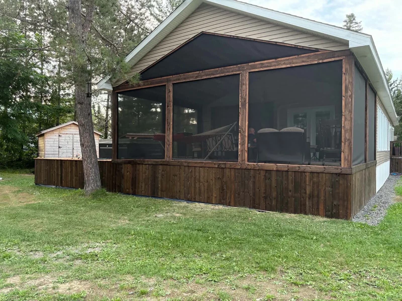 Cottage porch with completed dark wood skirting